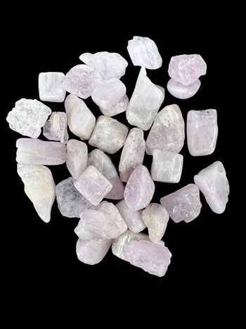 Soft pink Morganite crystals with heart chakra ritual tools at Raven’s Cauldron.