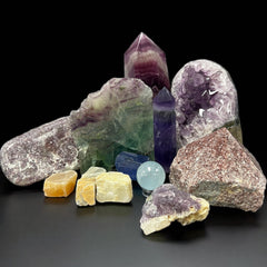 Crystals for Pisces zodiac including aquamarine, amethyst, and moonstone arranged for intuition and emotional healing.