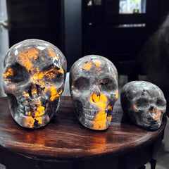 Yooperlite stone glowing orange under UV light – Raven’s Cauldron Delaware Ohio