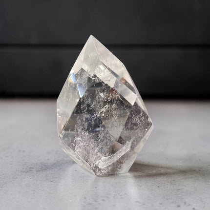 Clear Quartz faceted flame crystal carving weighing 127 grams with polished surfaces and natural transparency, Raven's Cauldron, Delaware, OH