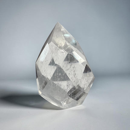 Clear Quartz faceted flame crystal carving weighing 127 grams with polished surfaces and natural transparency, Raven's Cauldron, Delaware, OH