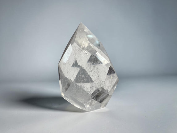 Clear Quartz faceted flame crystal carving weighing 127 grams with polished surfaces and natural transparency, Raven's Cauldron, Delaware, OH