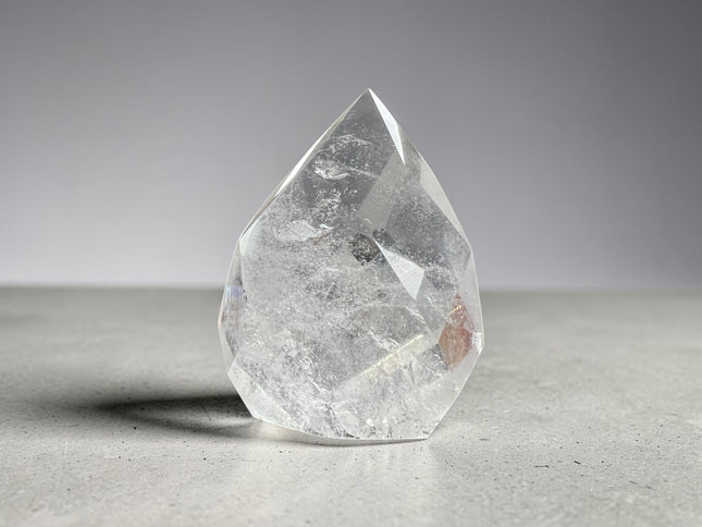 Clear Quartz faceted flame crystal weighing 145 grams with polished surfaces and natural transparency, Raven's Cauldron, Delaware, OH