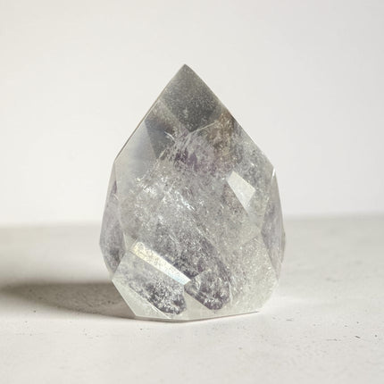 Clear Quartz faceted flame crystal weighing 157 grams with polished surfaces and natural transparency for clarity, energy amplification, and meditation work – Raven's Cauldron, Delaware, OH.