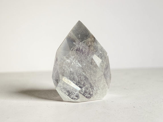 Clear Quartz faceted flame crystal weighing 157 grams with polished surfaces and natural transparency for clarity, energy amplification, and meditation work – Raven's Cauldron, Delaware, OH.