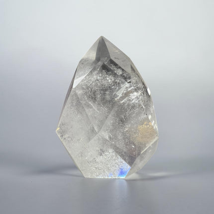 Clear Quartz faceted flame crystal weighing 157 grams with polished surfaces and natural transparency for clarity, energy amplification, and meditation work – Raven's Cauldron, Delaware, OH.