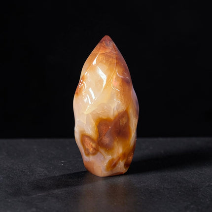Polished Carnelian Flame crystal weighing 189 grams with a natural druzy pocket on the bottom, displaying rich orange and red coloring, Raven's Cauldron, Delaware, OH