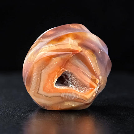 Polished Carnelian Flame crystal weighing 189 grams with a natural druzy pocket on the bottom, displaying rich orange and red coloring, Raven's Cauldron, Delaware, OH