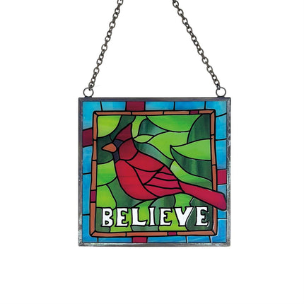 Stained glass panel with a red bird and 'BELIEVE' text on a white background Raven's Cauldron 6 N. Sandusky Street Delaware Ohio 43015