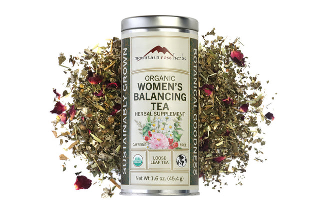 Mountain Rose Herbs Organic Women's Balancing Tea canister with loose tea leaves and flowers on a white background, Raven's Cauldron, 6 N Sandusky St, Delaware, OH 43015