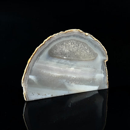 Polished grey agate freeform with white banding and quartz inclusions from Raven's Cauldron.