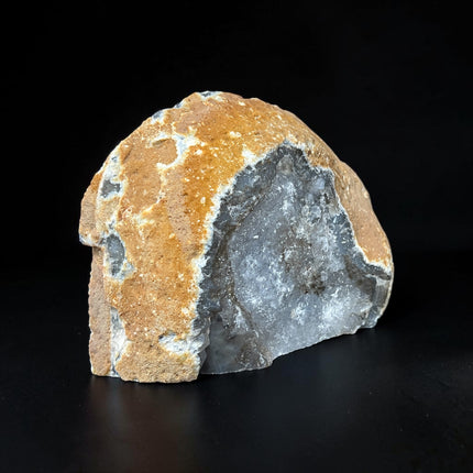 Polished grey agate freeform with white banding and quartz inclusions from Raven's Cauldron.