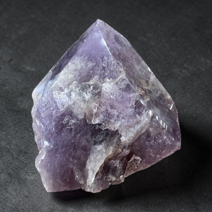 Amethyst semi-polished crystal point for spiritual protection, meditation, and third eye chakra energy from Raven's Cauldron, 6 N Sandusky St, Delaware, OH 43015