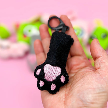 Plush cat paw bag charm keychain by Kawaii Hair Candy with soft kawaii kitty paw design
