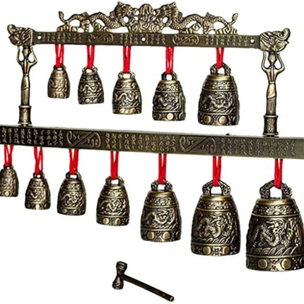 Decorative bell set with bronze finish and red strings on a white background from Raven's Cauldron 6 N Sandusky St. Delaware ohio 43015