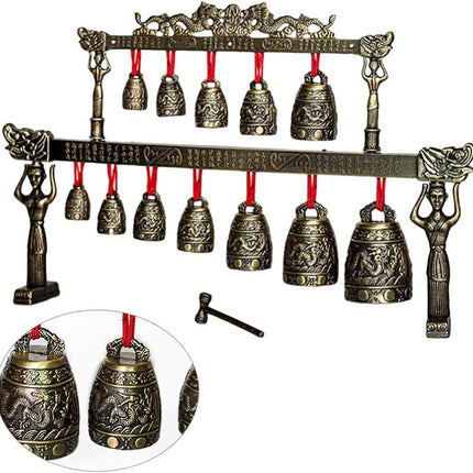 Decorative bell set with bronze finish and red strings on a white background from Raven's Cauldron 6 N Sandusky St. Delaware ohio 43015