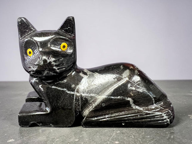 Black Calcite cat figurine hand carved polished crystal laying down for grounding protection energy clearing Raven’s Cauldron, 6 N Sandusky St, Delaware, OH 43015