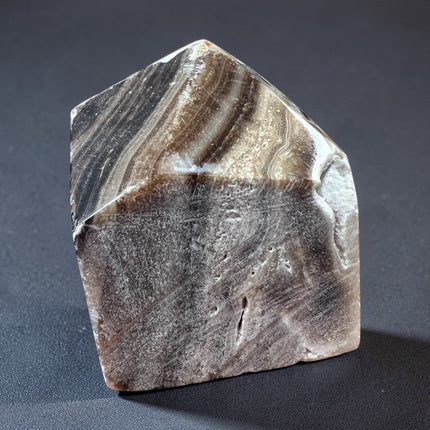 Chocolate Calcite semi-polished crystal point for grounding energy and meditation from Raven's Cauldron, 6 N Sandusky St, Delaware, OH 43015