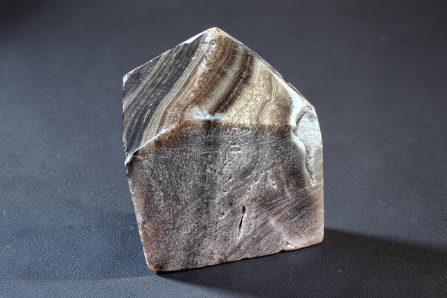 Chocolate Calcite semi-polished crystal point for grounding energy and meditation from Raven's Cauldron, 6 N Sandusky St, Delaware, OH 43015