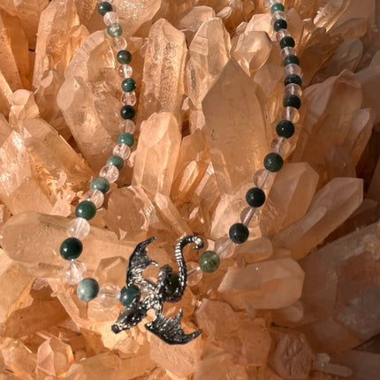 Necklace with dragon pendant on a crystal background