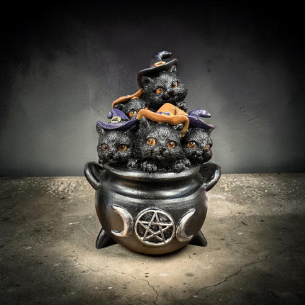 Nemesis Now Five Cheeky Cats in Cauldron resin figurine featuring five black kittens peeking from a witch's cauldron.