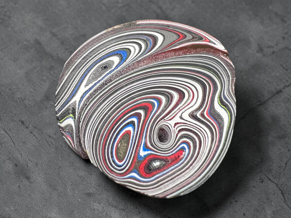 Polished Fordite Detroit Motor City Agate stone with colorful layered bands measuring 1.5 inches , Raven's Cauldron, 6 N Sandusky St, Delaware, OH 43015
