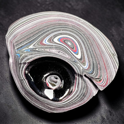 Polished Fordite Detroit Motor City Agate stone with colorful layered bands measuring 1.5 inches , Raven's Cauldron, 6 N Sandusky St, Delaware, OH 43015