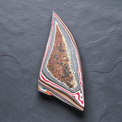 Polished Fordite Detroit Motor City Agate with colorful layered automotive paint bands, 9 grams, 3 inches long, Raven's Cauldron, 6 N Sandusky St, Delaware, OH 43015