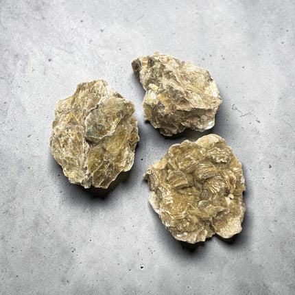 Natural Golden Mica mineral specimen measuring approximately 2 to 3 inches with shimmering golden layered crystals.