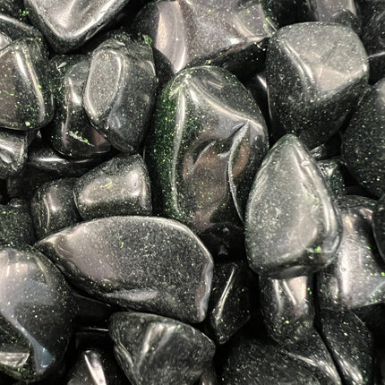 Green Goldstone tumbled stone with sparkling metallic flecks, polished finish, approximately 1 inch, photographed on a white background.