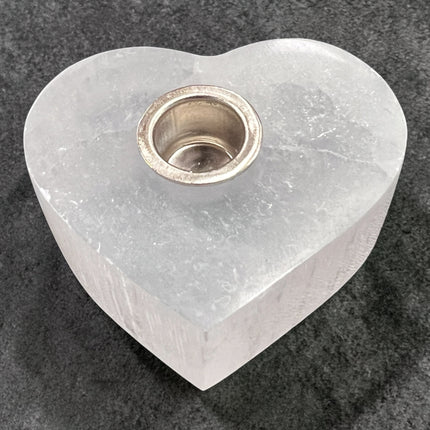 Selenite heart candle holder for chime candles, polished crystal holder for energy cleansing and altar use at Raven’s Cauldron, 6 N Sandusky St, Delaware, OH 43015