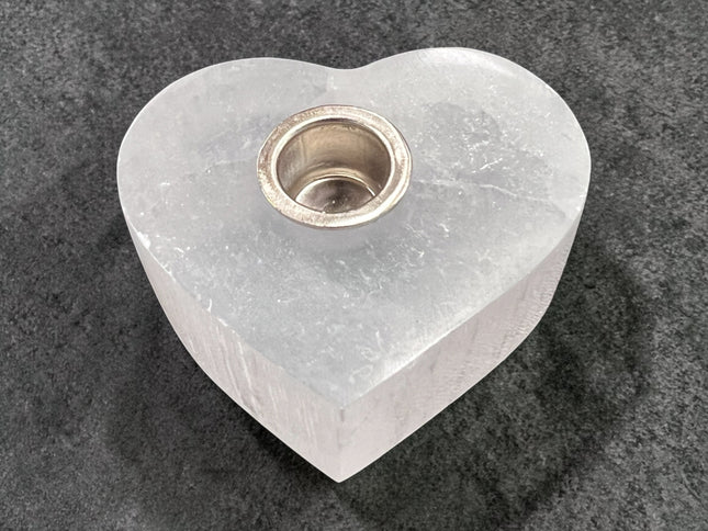 Selenite heart candle holder for chime candles, polished crystal holder for energy cleansing and altar use at Raven’s Cauldron, 6 N Sandusky St, Delaware, OH 43015