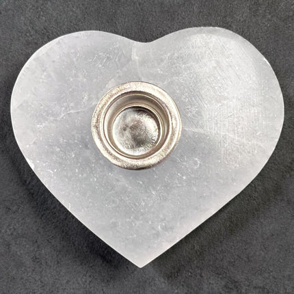 Selenite heart candle holder for chime candles, polished crystal holder for energy cleansing and altar use at Raven’s Cauldron, 6 N Sandusky St, Delaware, OH 43015