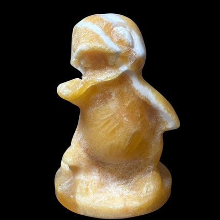 5-inch hand-carved Orange Stripe Calcite Charmander with bold orange and white banding, polished to a high shine