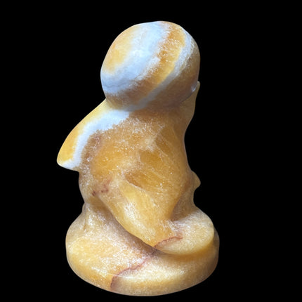 5-inch hand-carved Orange Stripe Calcite Charmander with bold orange and white banding, polished to a high shine