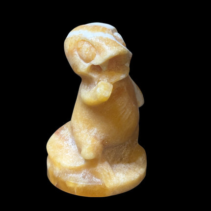 5-inch hand-carved Orange Stripe Calcite Charmander with bold orange and white banding, polished to a high shine