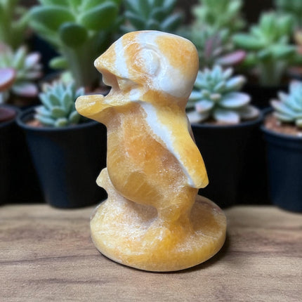 5-inch hand-carved Orange Stripe Calcite Charmander with bold orange and white banding, polished to a high shine
