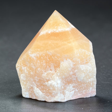 Orange Calcite semi-polished crystal point for creativity and solar plexus chakra energy from Raven's Cauldron, 6 N Sandusky St, Delaware, OH 43015