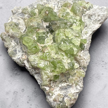 Natural Peridot in Matrix specimen from Pakistan featuring a double-terminated Peridot crystal, 206 grams, 3.5 x 2.75 x 1 inches – Raven's Cauldron, Delaware, OH