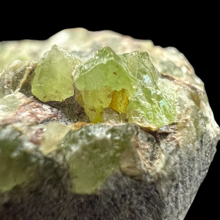 Natural Peridot in Matrix crystal specimen from Pakistan weighing 210 grams with vibrant green Peridot crystals in host rock – Raven's Cauldron, Delaware, OH

Secondary Image Alt Text: