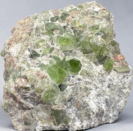 Natural Peridot in Matrix crystal specimen from Pakistan weighing 307 grams with vibrant green Peridot crystals in host rock, Raven's Cauldron, Delaware, OH.
