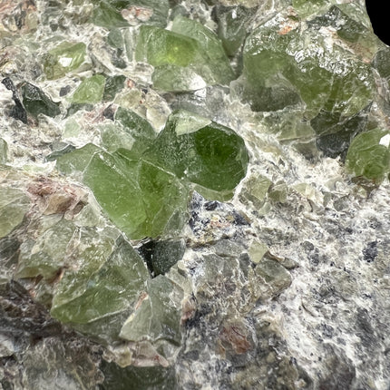 Natural Peridot in Matrix crystal specimen from Pakistan weighing 307 grams with vibrant green Peridot crystals in host rock, Raven's Cauldron, Delaware, OH.