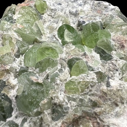 Natural Peridot in Matrix crystal specimen from Pakistan weighing 307 grams with vibrant green Peridot crystals in host rock, Raven's Cauldron, Delaware, OH.