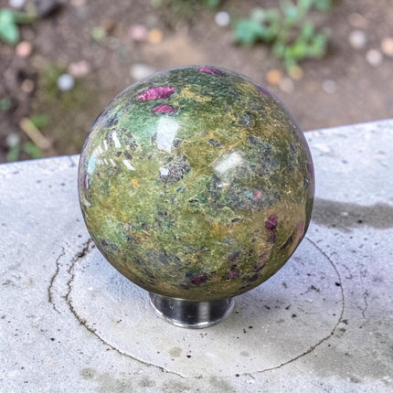 Large polished Ruby in Fuchsite crystal sphere weighing 1931 grams and measuring approximately 3.75 inches, featuring vibrant green fuchsite with natural deep ruby inclusions.