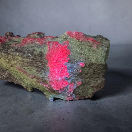 Collector's grade 2,230 gram Ruby in Zoisite featuring vibrant low-iron raw ruby crystal clusters within natural green zoisite matrix displayed as a one-of-a-kind mineral specimen.