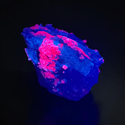 Collector's grade 2,230 gram Ruby in Zoisite featuring vibrant low-iron raw ruby crystal clusters within natural green zoisite matrix displayed as a one-of-a-kind mineral specimen.