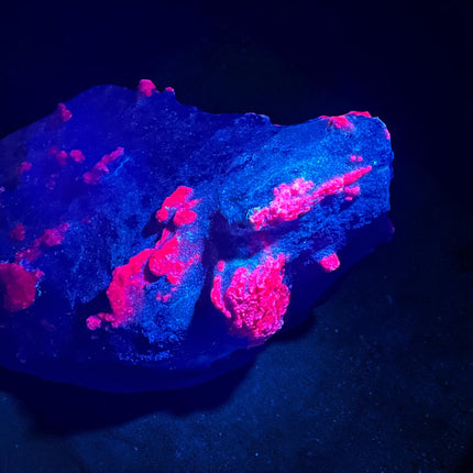 Collector's grade 2,230 gram Ruby in Zoisite featuring vibrant low-iron raw ruby crystal clusters within natural green zoisite matrix displayed as a one-of-a-kind mineral specimen.