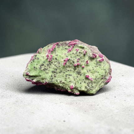 Collector's grade 2,230 gram Ruby in Zoisite featuring vibrant low-iron raw ruby crystal clusters within natural green zoisite matrix displayed as a one-of-a-kind mineral specimen.