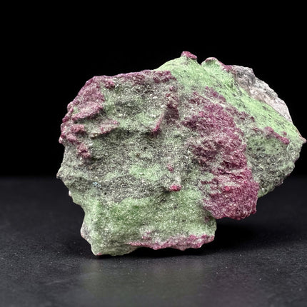 Collector's grade 2,230 gram Ruby in Zoisite featuring vibrant low-iron raw ruby crystal clusters within natural green zoisite matrix displayed as a one-of-a-kind mineral specimen.