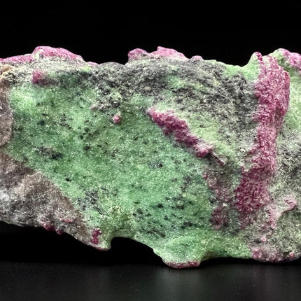 Collector's grade 2,230 gram Ruby in Zoisite featuring vibrant low-iron raw ruby crystal clusters within natural green zoisite matrix displayed as a one-of-a-kind mineral specimen.